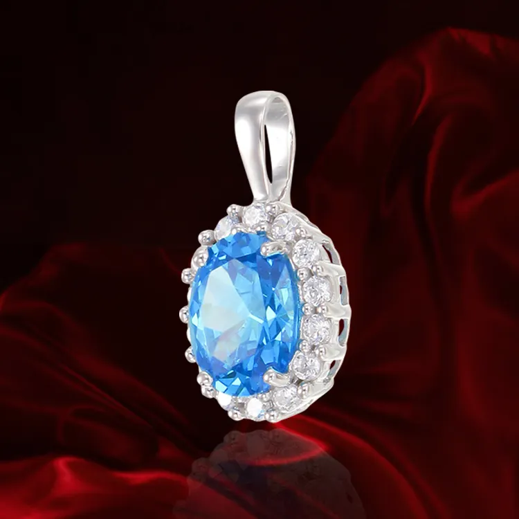 Delicate Sparkling Blue Pendant with Halo