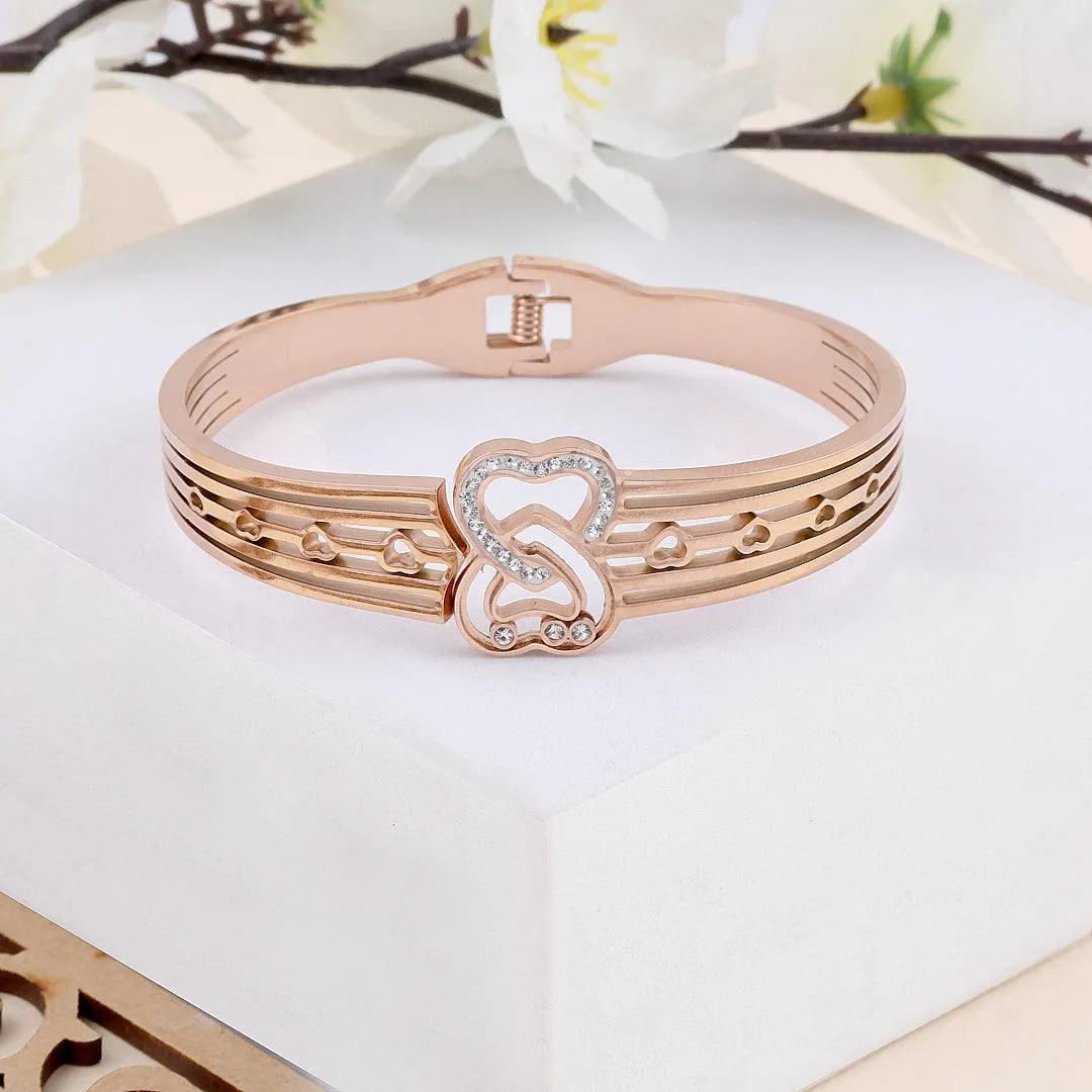 Rose Gold Plated Bracelet with Interlocking Heart Design and Crystal Accents".